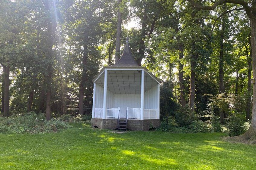 A gazebo in a wooded area. 4