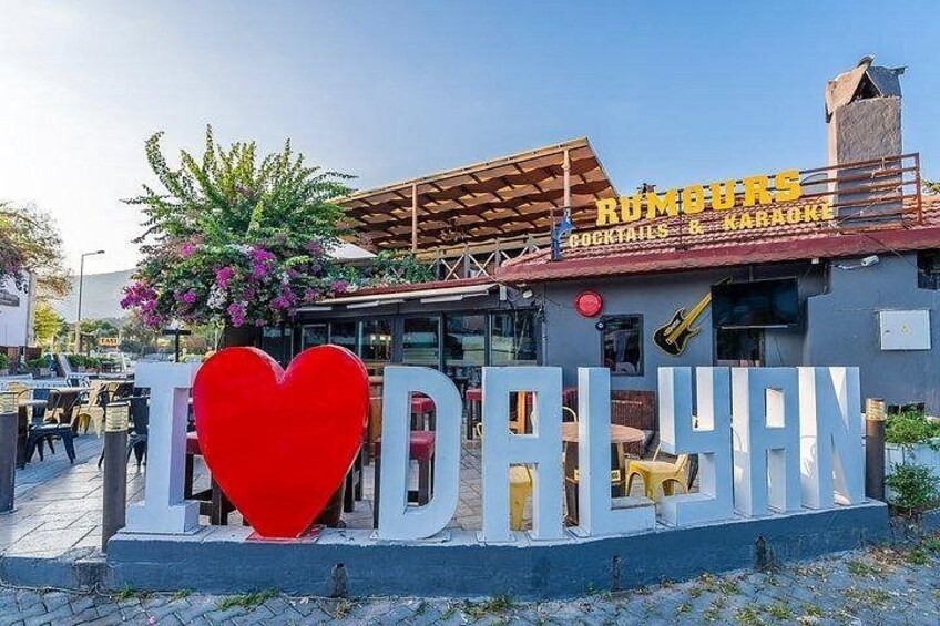 A building with a sign that reads 'I ♥ DALYAN' and 'ROMOURS COCKTAILS & KARAOKE'. 5