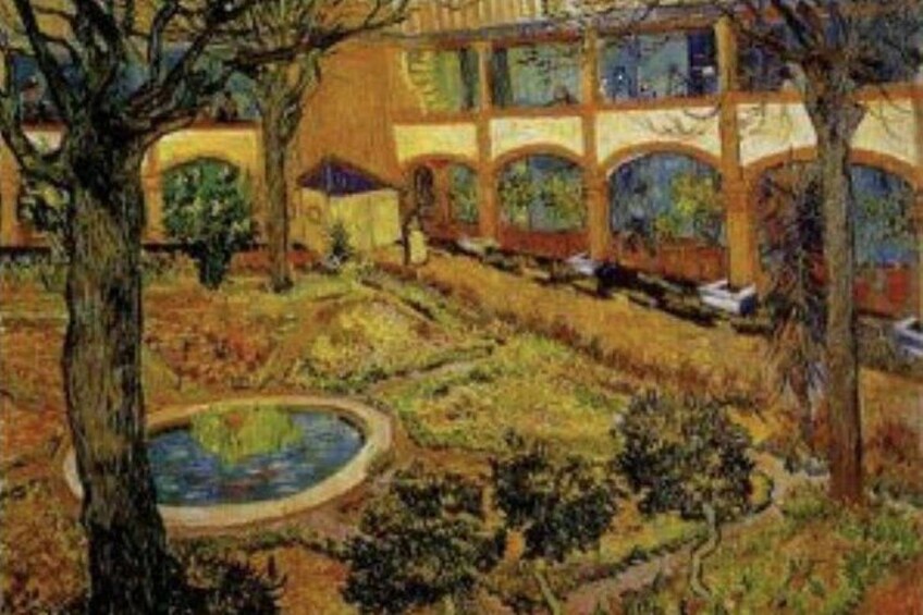 A garden with a fountain, trees, and a building with arched windows. 5