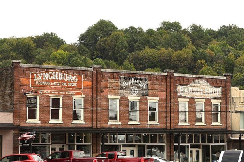 A historic building with signs for 'Lynchburg Hardware & General Store' and 'Parkside Shop'. 4