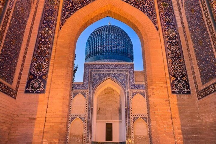 A large, ornate archway with a blue dome structure. 1