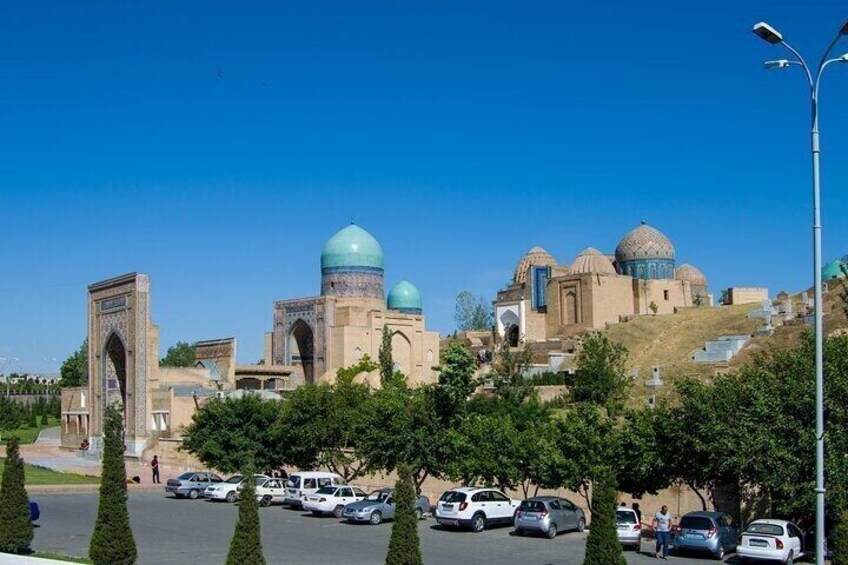A mosque with domes and an archway. 5