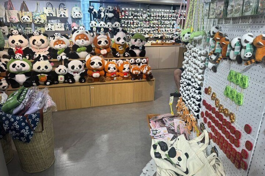 A store with shelves of panda plush toys and various bags. 3