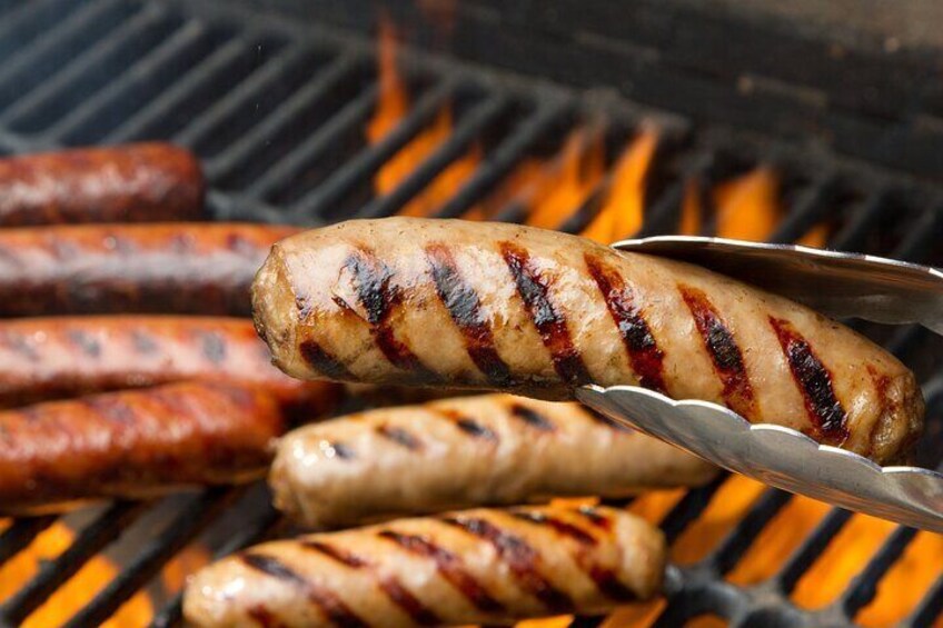 Sausages being grilled on a barbecue. 1