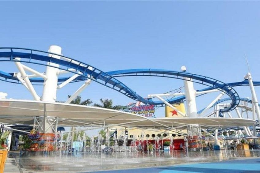 A water park with roller coasters and a pool. 1