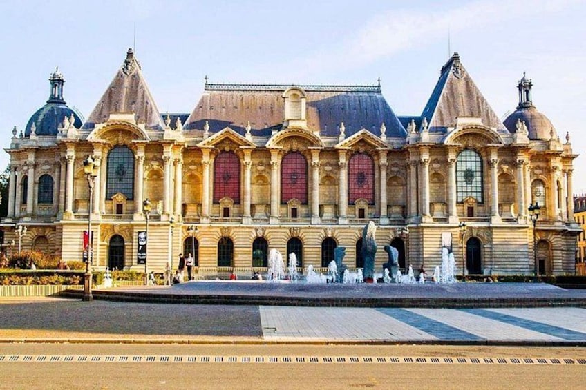 A large, ornate building with multiple domes and arched windows. 4