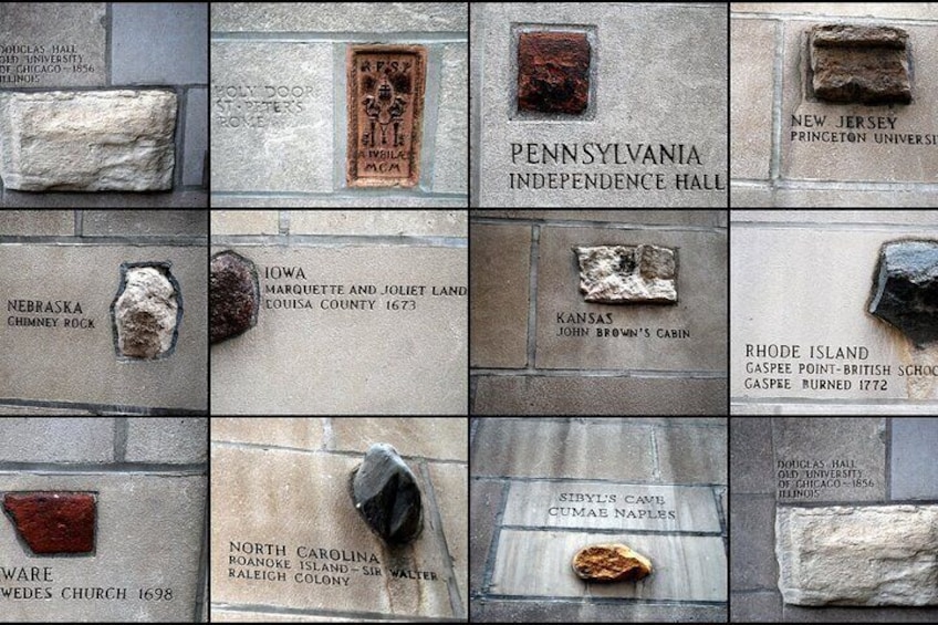 A collection of historical markers with inscriptions and artifacts. 3
