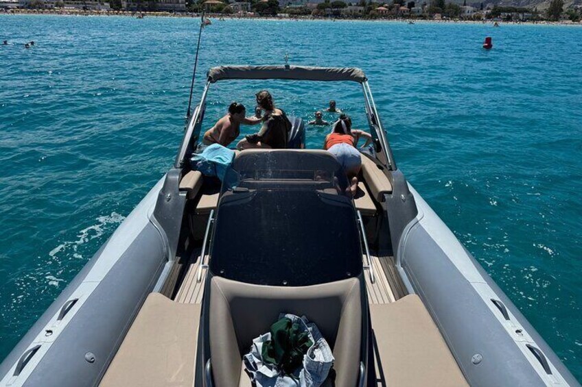 A boat with people on the water. 2