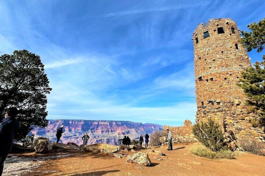 A stone tower, a canyon, and a clear sky. 3