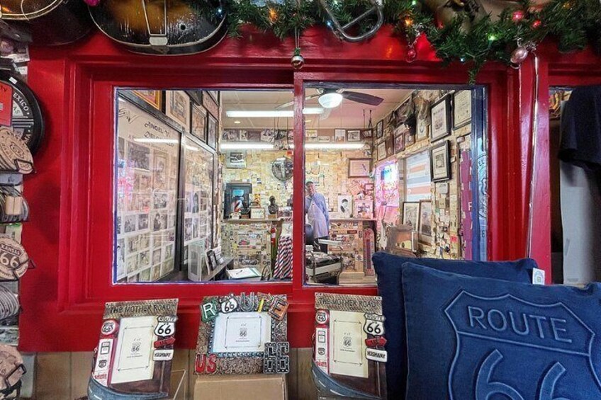 A Route 66-themed store with memorabilia and a vintage telephone booth. 4