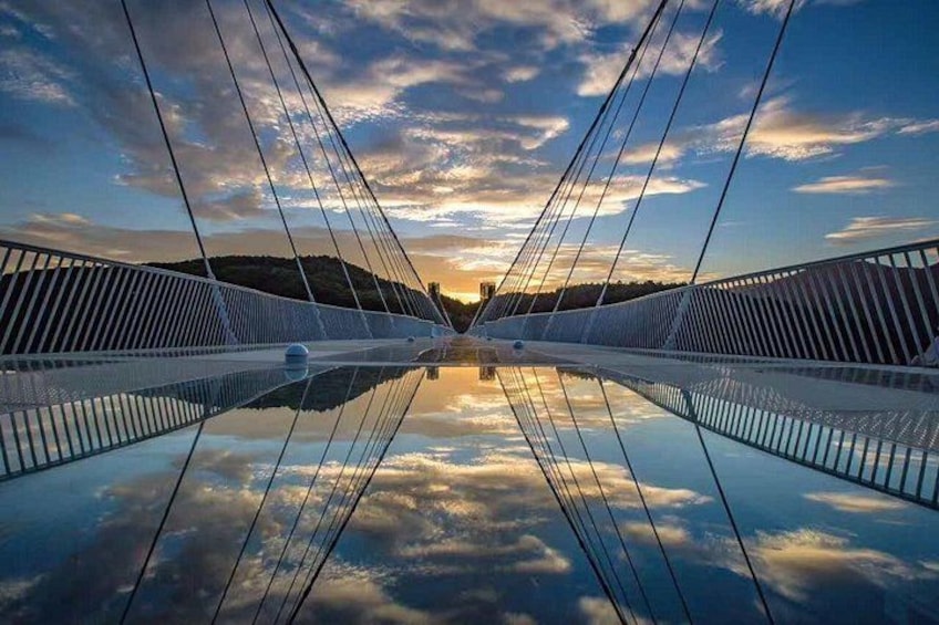 A suspension bridge with cables and a clear sky. 1