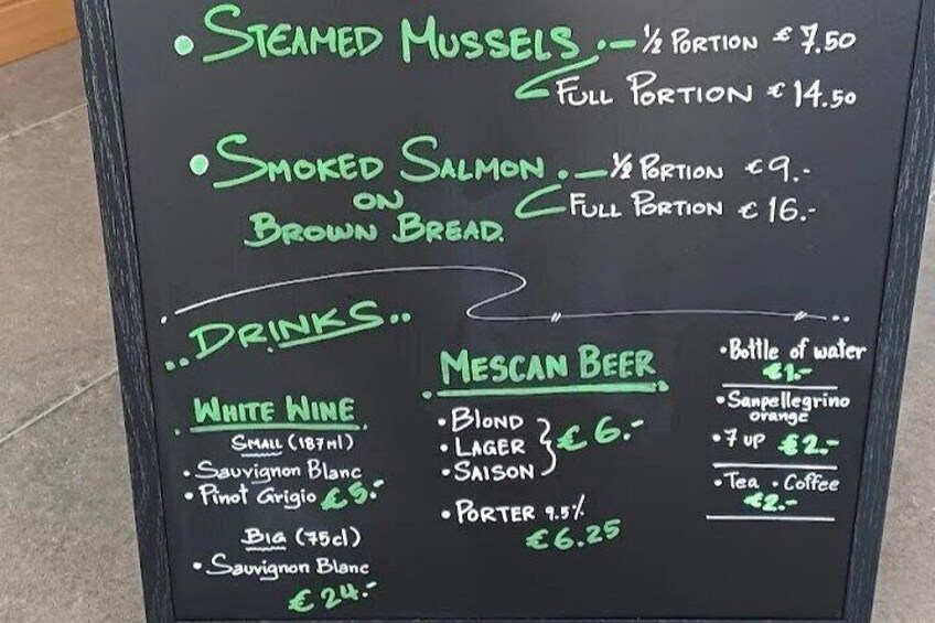 A menu with items like steamed mussels, smoked salmon, and various drinks including white wine and mescan beer. 5