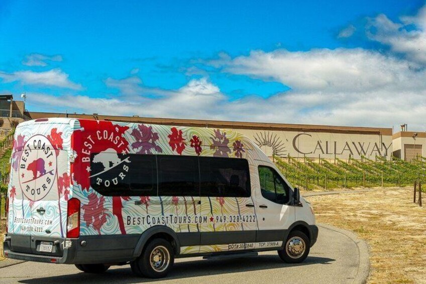 A tour bus parked in front of a building with 'Callaway' signage. 4