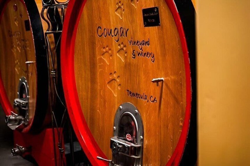 Wooden wine barrels with 'Cougar Vineyard & Winery' and 'Temecula, CA' engraved on them. 5