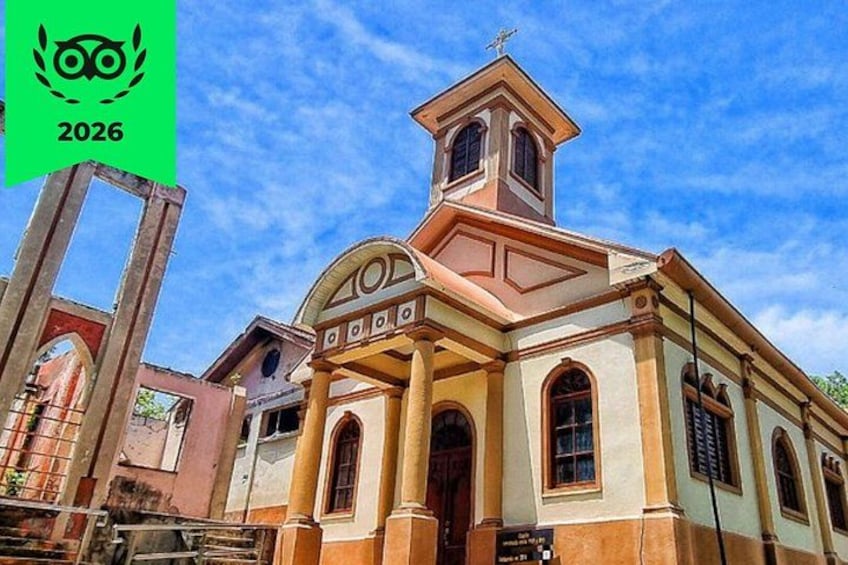 A church with a bell tower and arched windows. 1