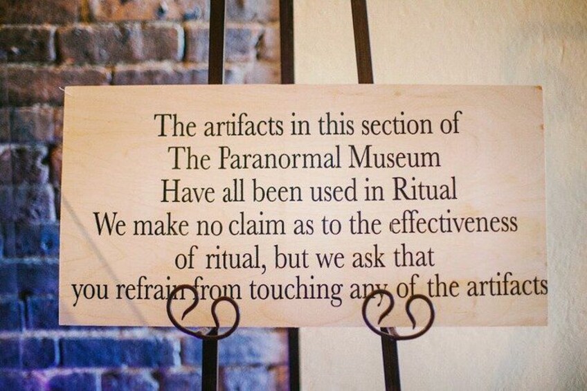 A sign with text about artifacts in a museum. 4