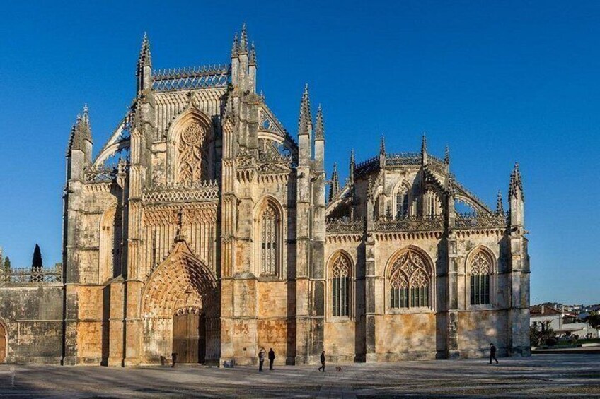 A large Gothic cathedral with intricate stonework and pointed arches. 1