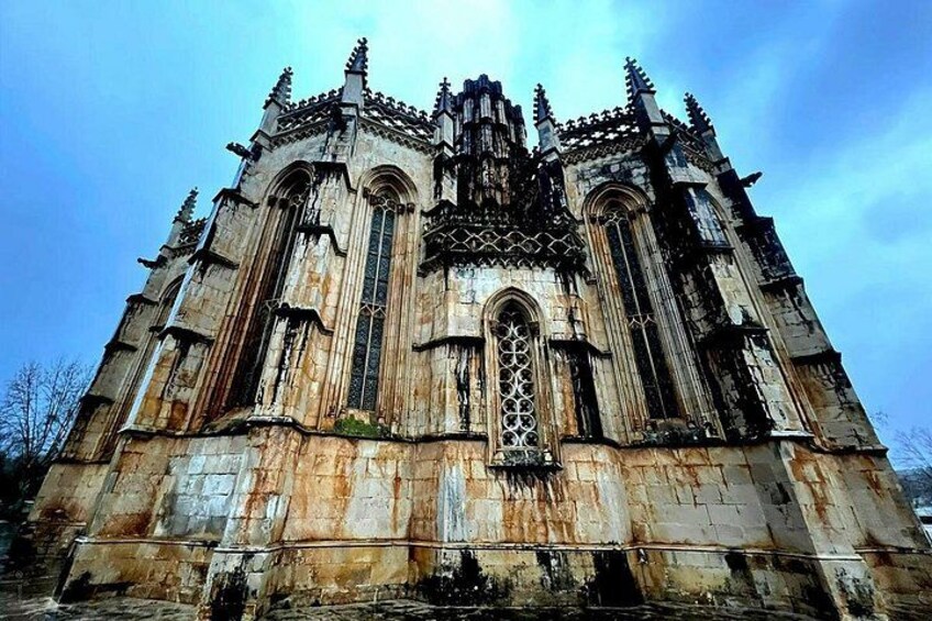 A large, historic cathedral with intricate Gothic architecture, including pointed arches and detailed stone carvings. 2