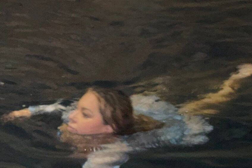 A person swimming in a body of water. 5