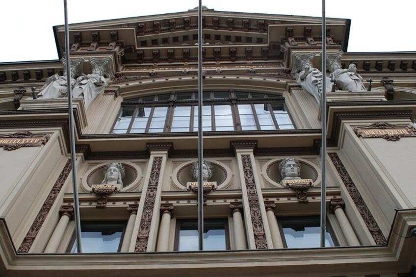A classical building with ornate columns and statues. 5