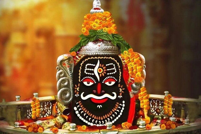 A statue with intricate designs and floral decorations. 1