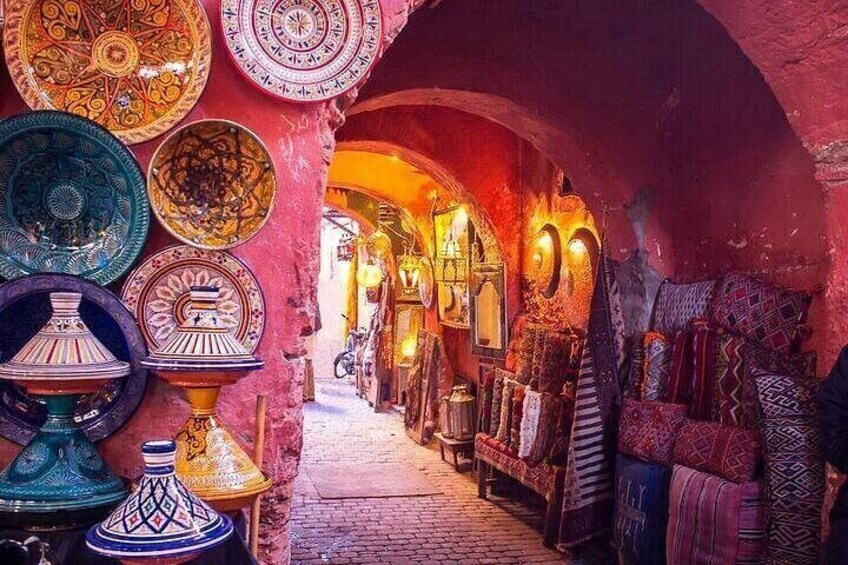 A narrow alley with colorful Moroccan tiles and traditional lamps. 5