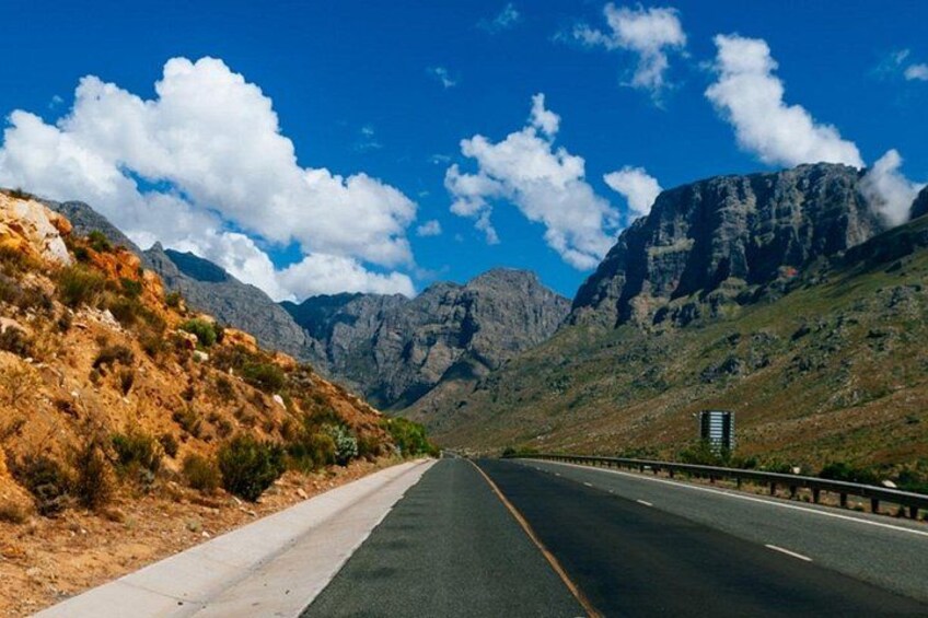 A highway with mountains in the background. 3
