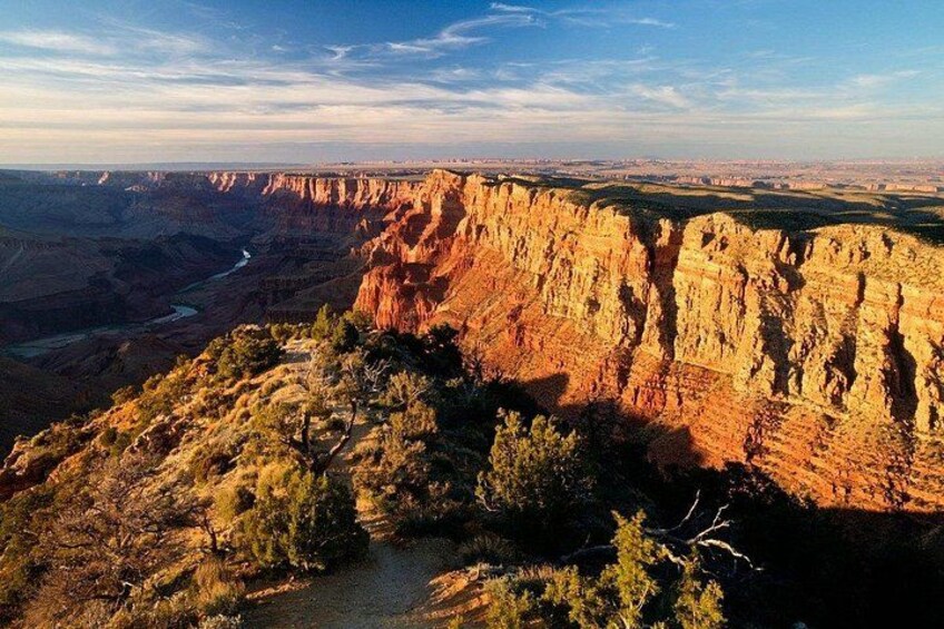 A canyon with steep cliffs and a river. 4