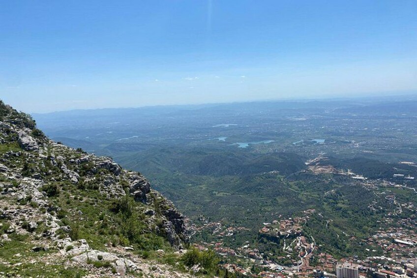 A mountainous landscape with rocky terrain and a valley below. 2