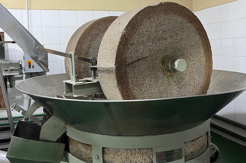 Stone wheel for crushing olives at Pas Rai la Olivicola 5