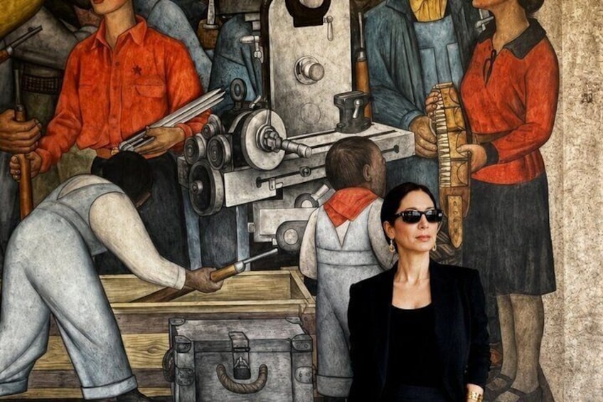 A mural with people engaged in various activities, including a person operating a lathe machine, another playing a saxophone, and a child observing. 2