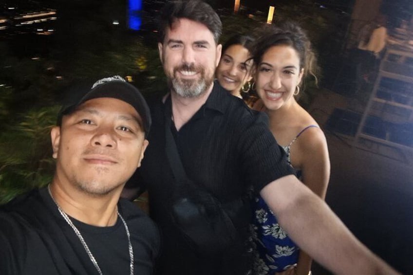 A group of people outdoors at night. 2