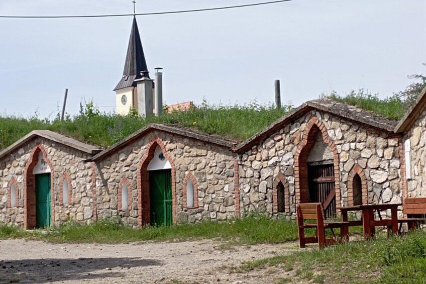 The cellars feature a typical stone façade with pseudo-Gothic arches. 4