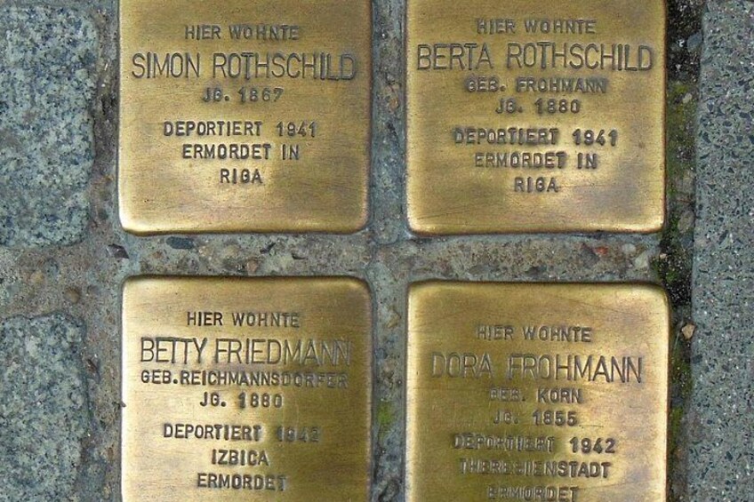 Four brass plaques with names and dates. 4