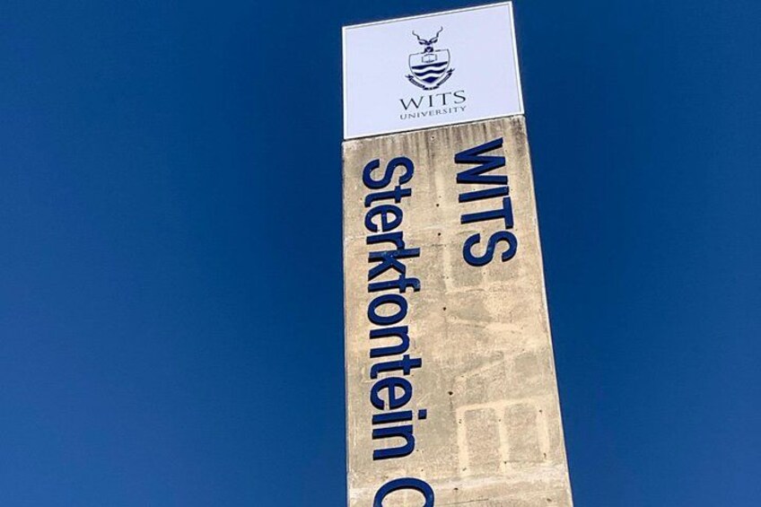 A sign with the text 'WITS Sterkfontein Campus' and the WITS University logo. 4