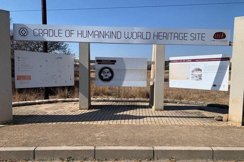 A sign for the Cradle of Humankind World Heritage Site with informational panels. 3