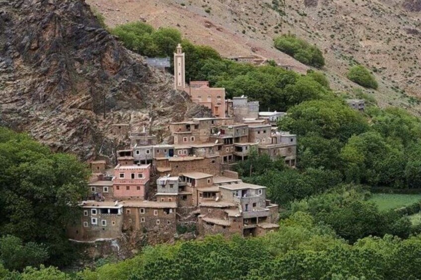 A terraced village with traditional buildings nestled in a mountainous area. 4
