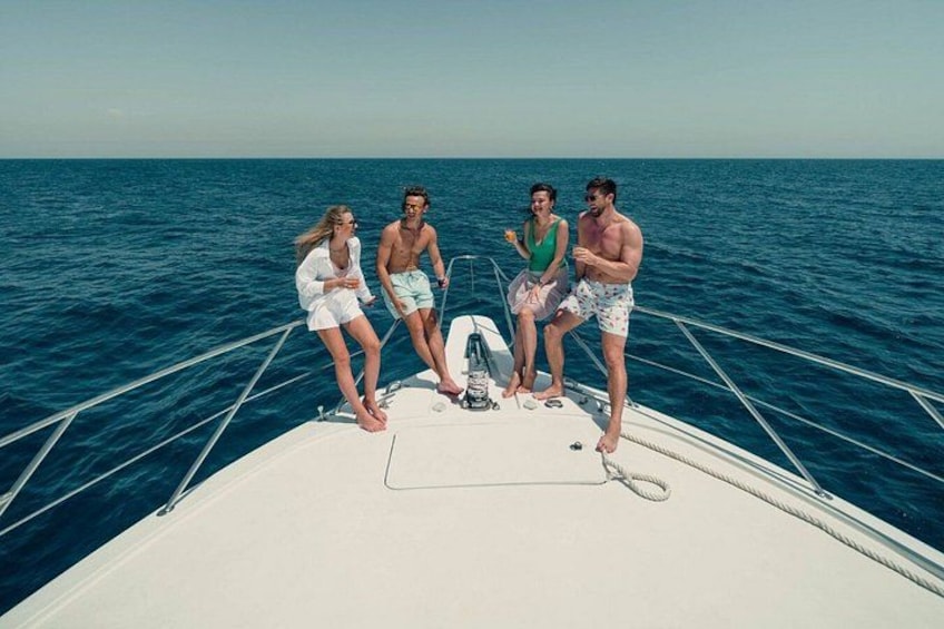 A group of people on a boat in the ocean. 2