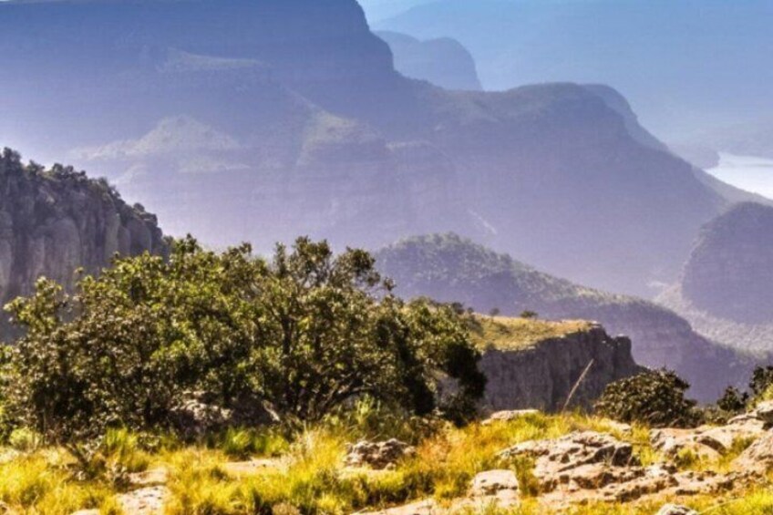 A mountainous landscape with rocky outcrops and sparse vegetation. 5