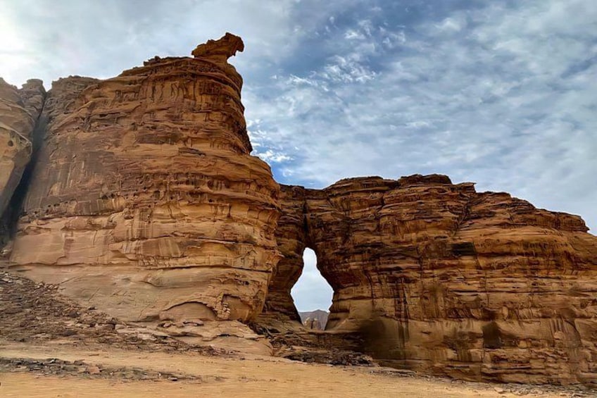 A rock formation with a natural archway. 3