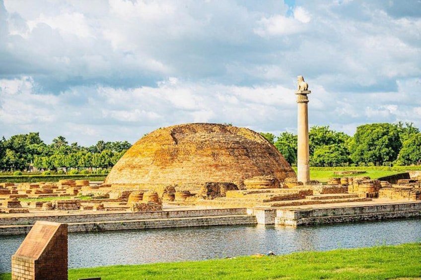 Ancient ruins with a large dome structure and a tall column. 5