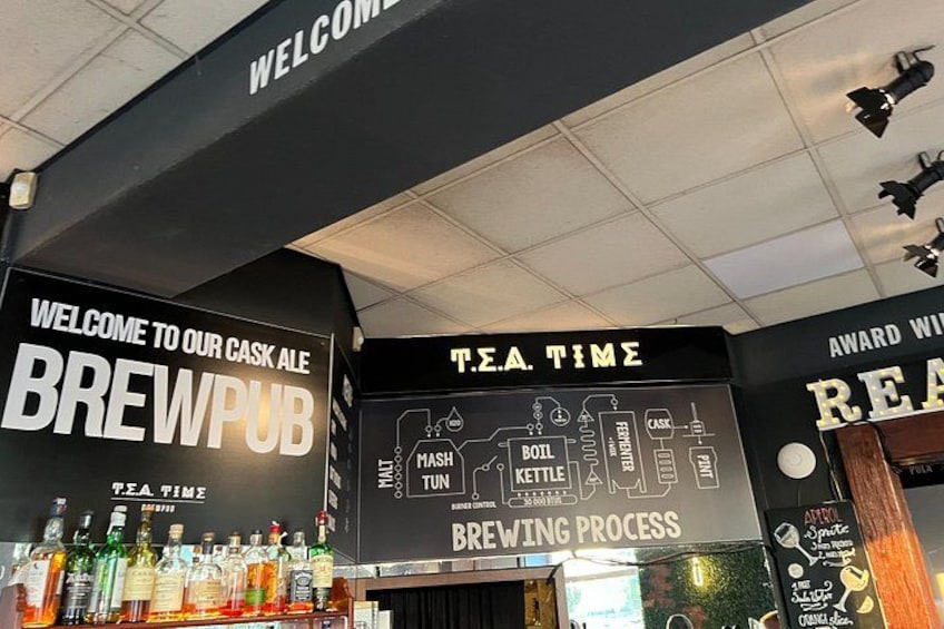 A cask ale brewpub with a brewing process display. 2