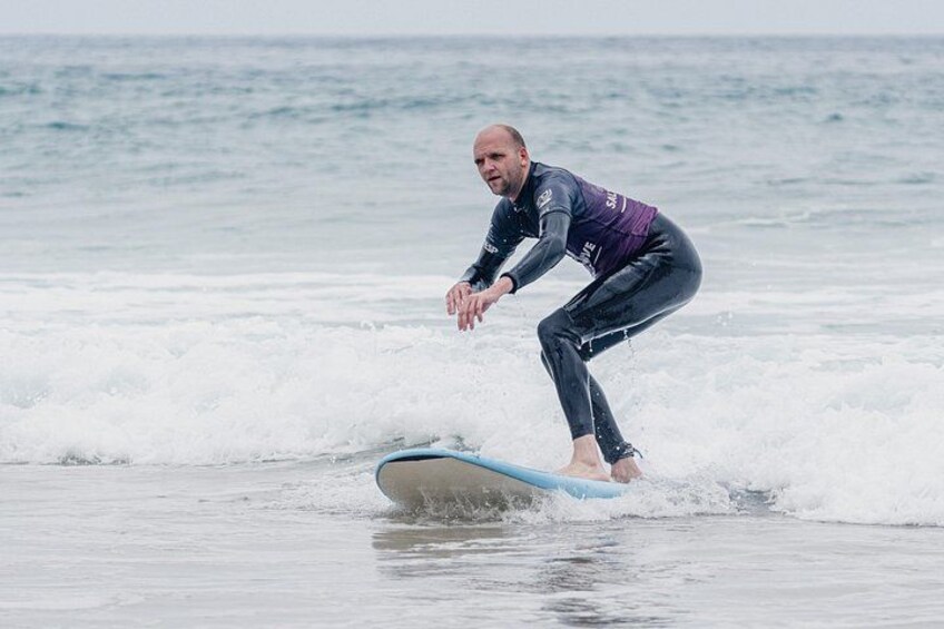 A person surfing on a wave in the ocean. 3