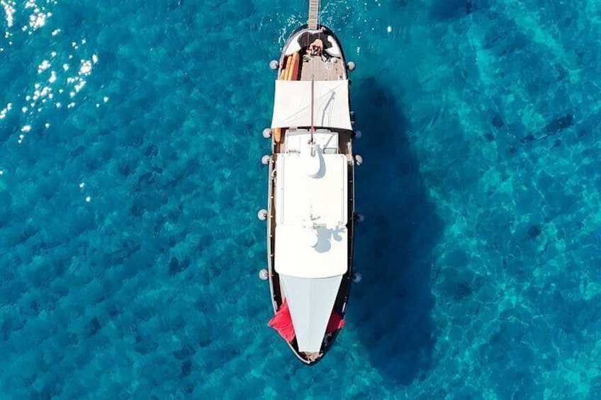 A boat on clear blue water. 3
