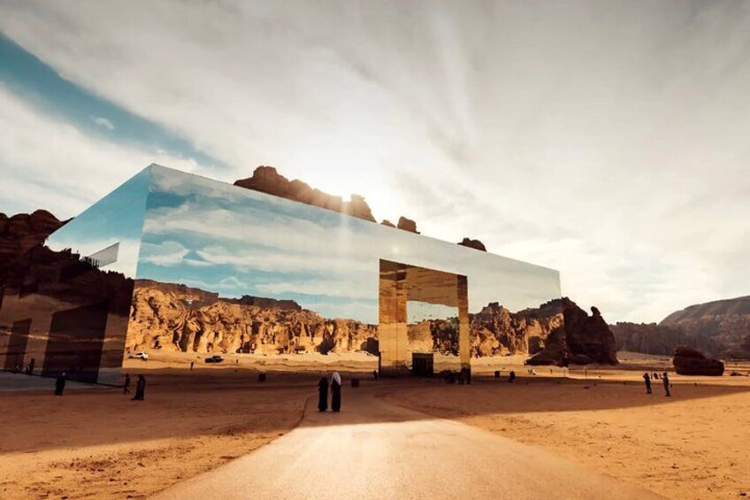 A desert landscape with a modern building structure. 3