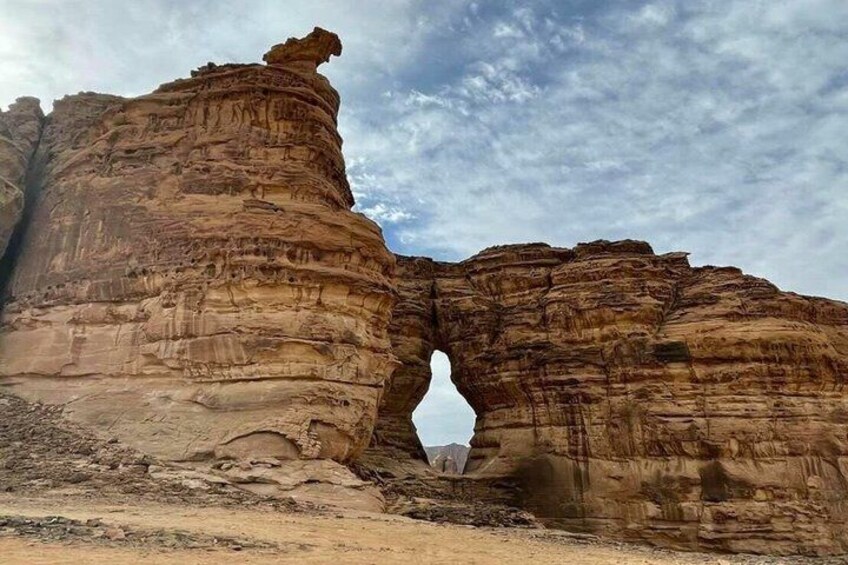A rock formation with a natural arch. 2
