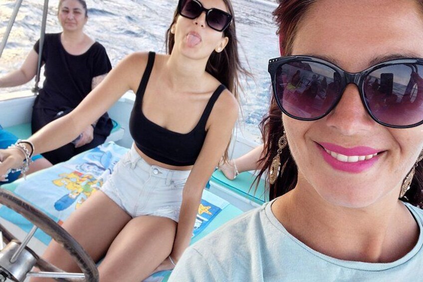 A boat with two people, one steering and one sitting. 3