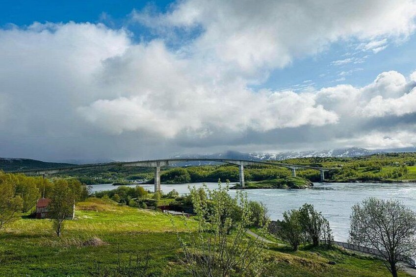 A river, a bridge, and a mountainous landscape. 2