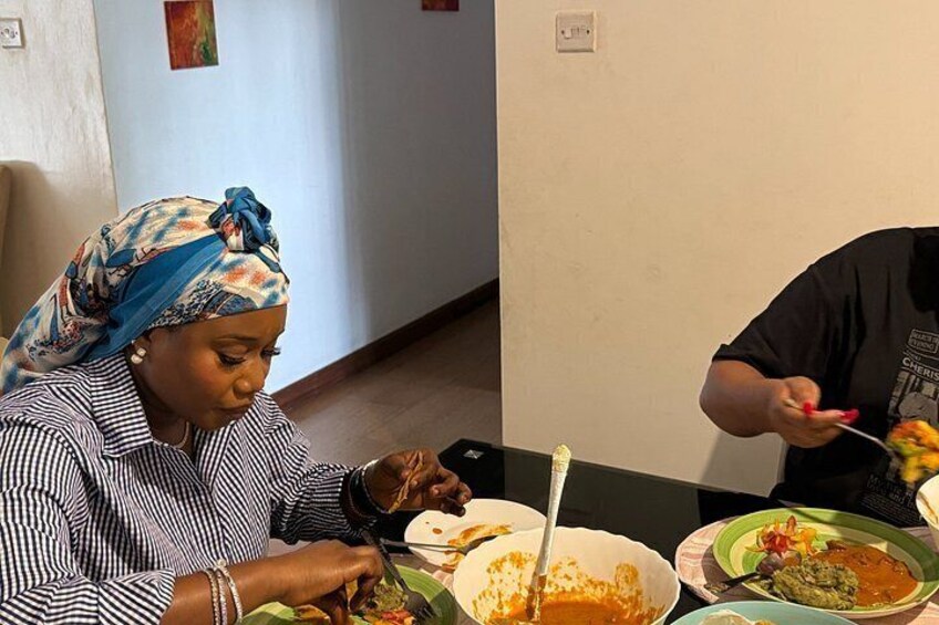 Two people dining at a table with various dishes. 4