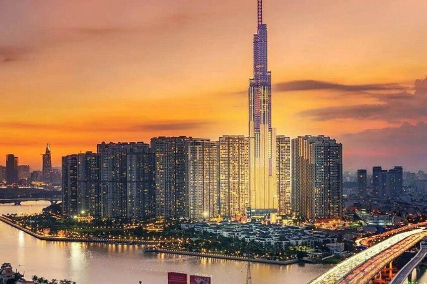 A cityscape with a prominent skyscraper, a river, and a bridge. 4